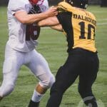Combatants clash in Dal's first game against a CIS squad since 1976. Photo by Rob Grandy