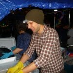 Phil Boydelatour washing supper dishes at Zuccotti Park Oct. 11. Photo by Katrina Pyne.