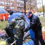 Police taking down tents. Photo by Rob Sangster-Poole.