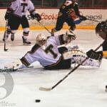 Brendon MacDonald tries to get a shot past St Thomas goalie, Charles Lavigne. Photo by Martina Marien