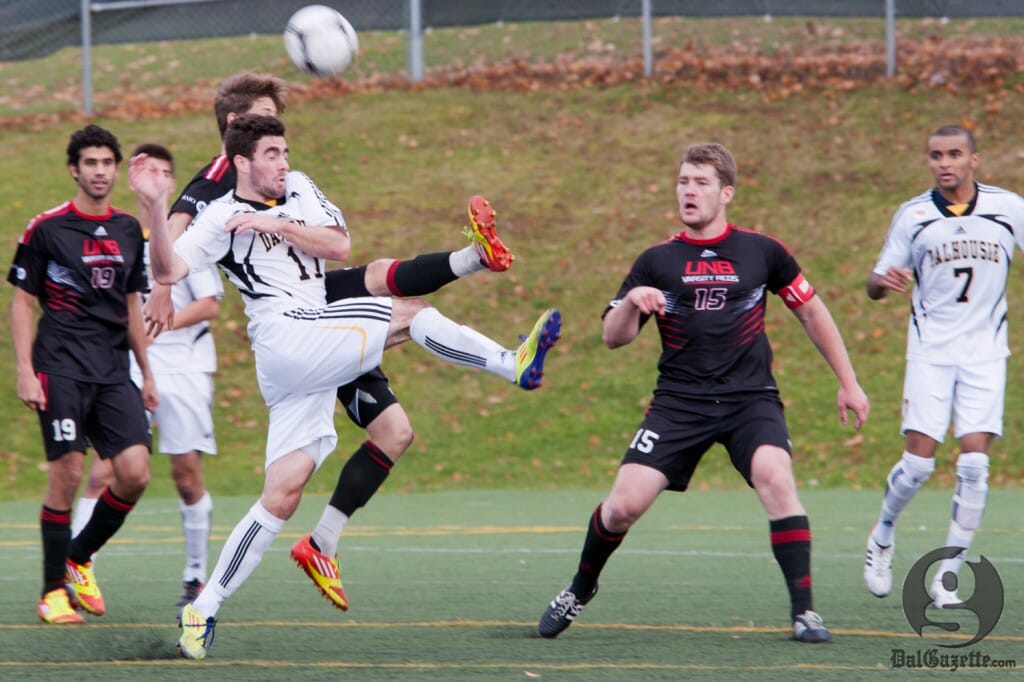 Tyler Lewars fights for possession in Dal's fourth consecutive semifinal loss. (Photo via UPEI Photography) Tyler Lewars fights for possession in Dal's fourth consecutive semifinal loss. (Photo via UPEI Photography)
