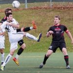 Tyler Lewars fights for possession in Dal's fourth consecutive semifinal loss. (Photo via UPEI Photography)