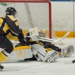 Tigers keeper Bobby Nadeau makes a desperation save against St. Thomas Jan. 25. (David Munro photo)