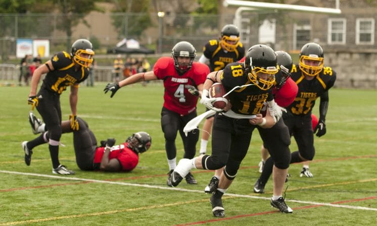 Tigers football win home opener over defending champs