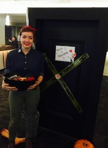 Emmalies Vander-Velde, with the DSU, hands out candy to trick-or-treaters.