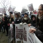 Front line of protesters marching