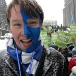 Blue face paint in protest