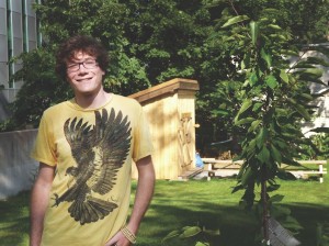 Alexander Gopen enjoys the fruits of his labour in the new Henry Street garden. Photo by Adam Faber