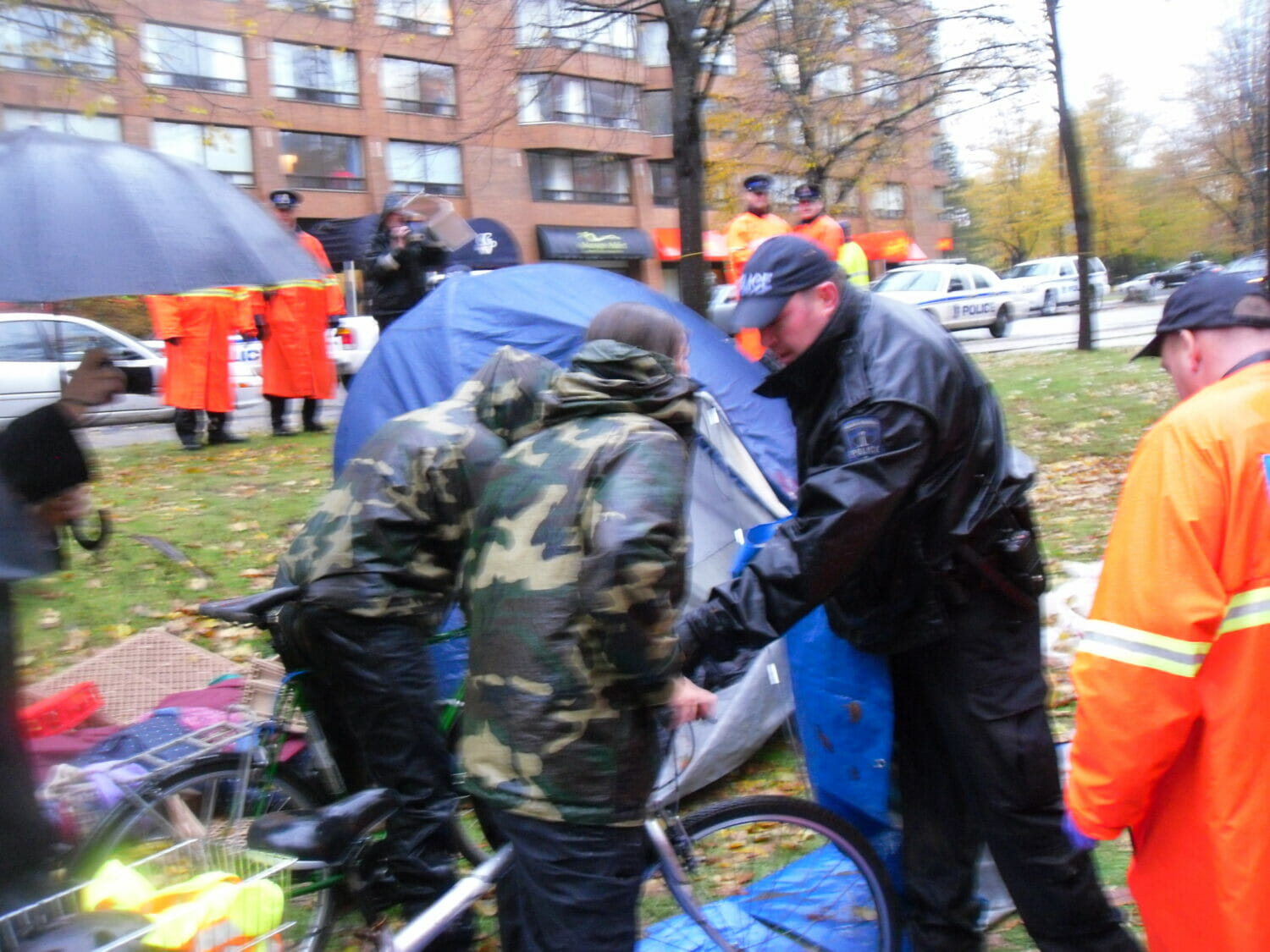 Police taking down tents. Photo by Rob Sangster-Poole.