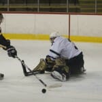 UPEI goalie Jhase Sniderman finds himself out of position. Photo by Rob Grandy.
