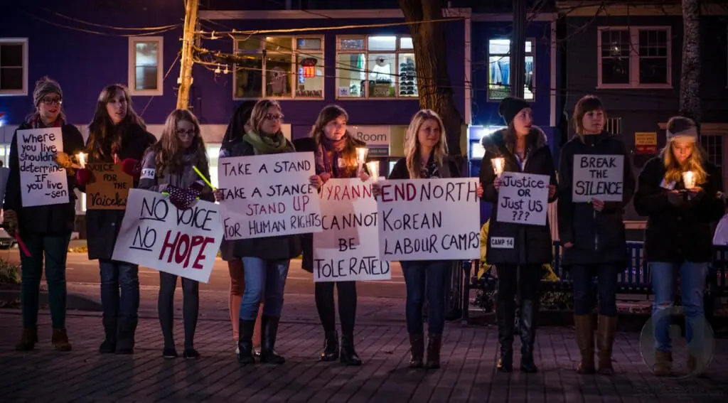 The ‘Parade of Rights’ stopped in Victoria Park before heading to the Security Forum.