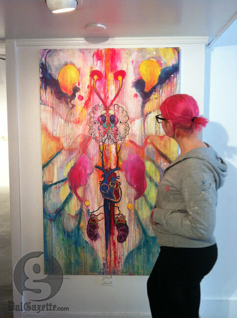 Tatyana Abel observes the exhibition at NSCAD. (Natalie McDonald photo)
