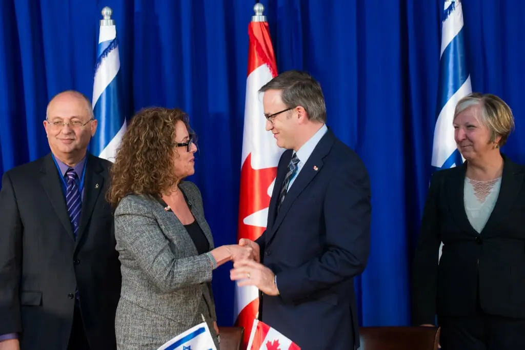 Dalhousie President Richard Florizone, centre right, signs a memorandum of understanding to create a ocean studies centre in Israel. (Submitted photo)