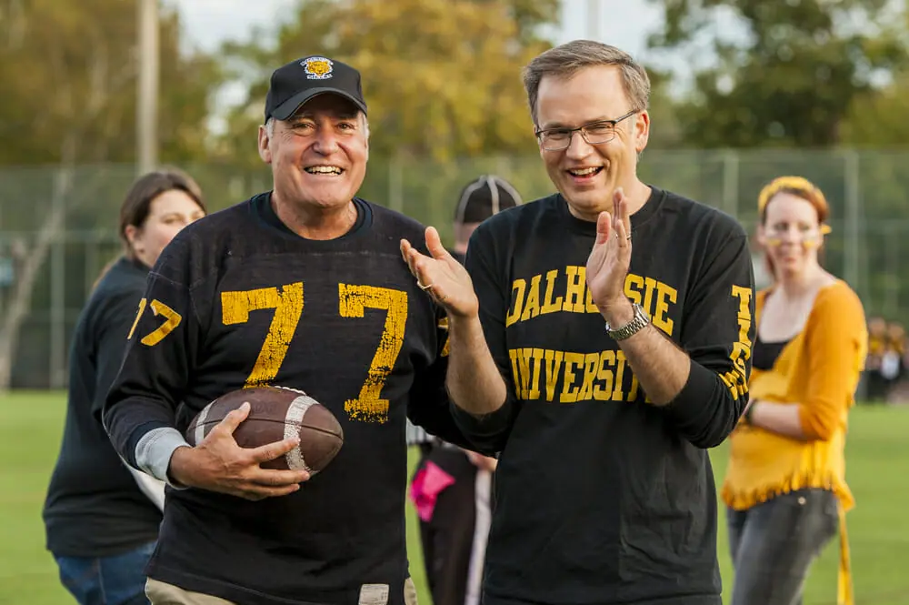 Dalhousie Alumni Association president Barrie Black, left, with Richard Florizone at the 2013 homecoming football game. (Photo by Chris Parent via Dal News)