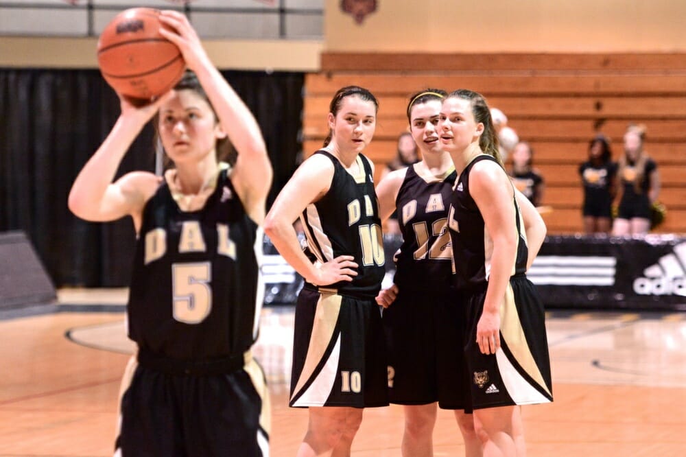 Tessa Stammberger (10) confers with her Tigers teammates. (Photo by Kit Moran)