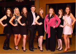 Volunteers pose at the Toast to the Coast fundraiser. ••• Photo supplied
