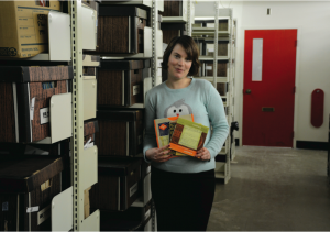Kim Hornak holds old CKDU reels in the archives of the Killam Library. • • • photo by Jennifer Gosnell
