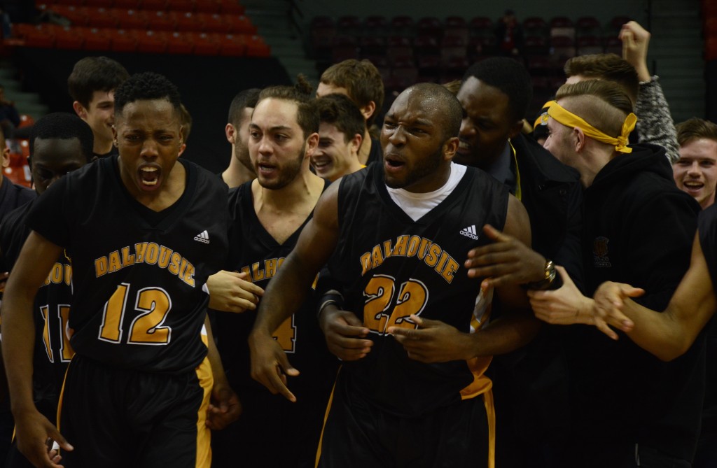 Kashrell Lawrence and teammates celebrate after the Tigers' nail-biting victory. Photo: Jennifer Gosnell
