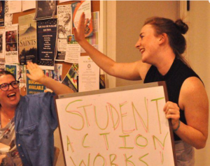 President of the King's Students' Union, Aidan McNally (right) celebrates what she calls a victory for the student movement Thursday.