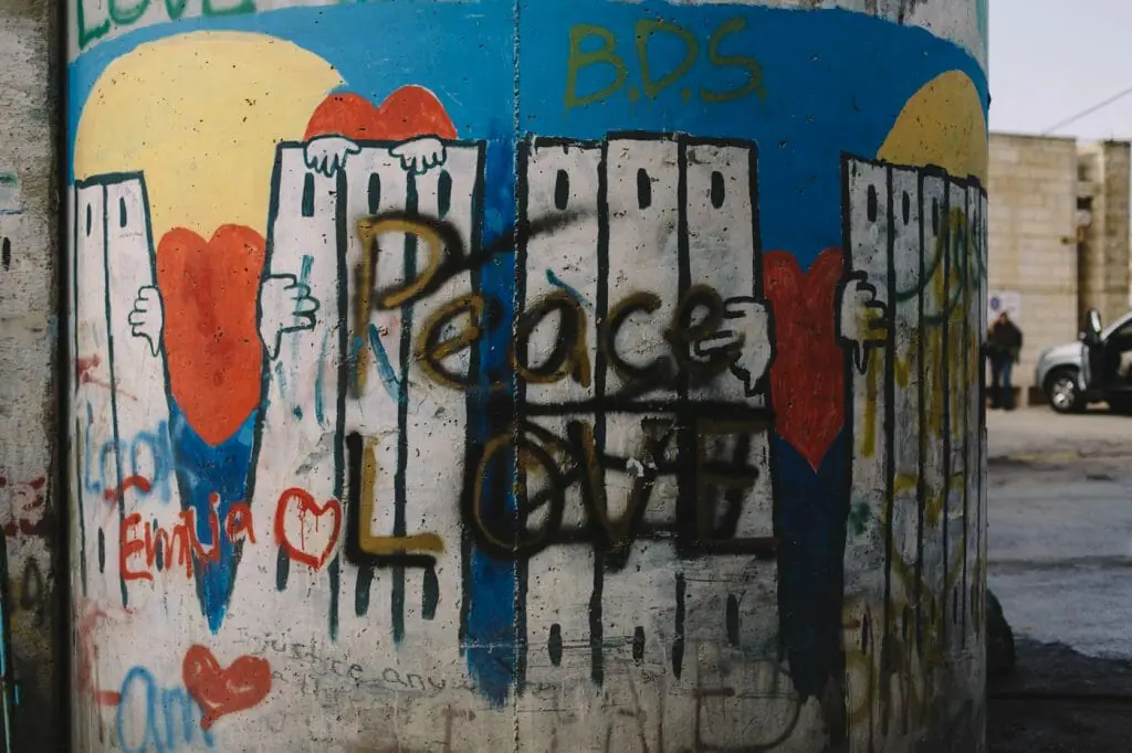 Peace, love, and BDS. Graffiti painted on a pillar of the Separation Barrier. Bethlehem, Palestine.