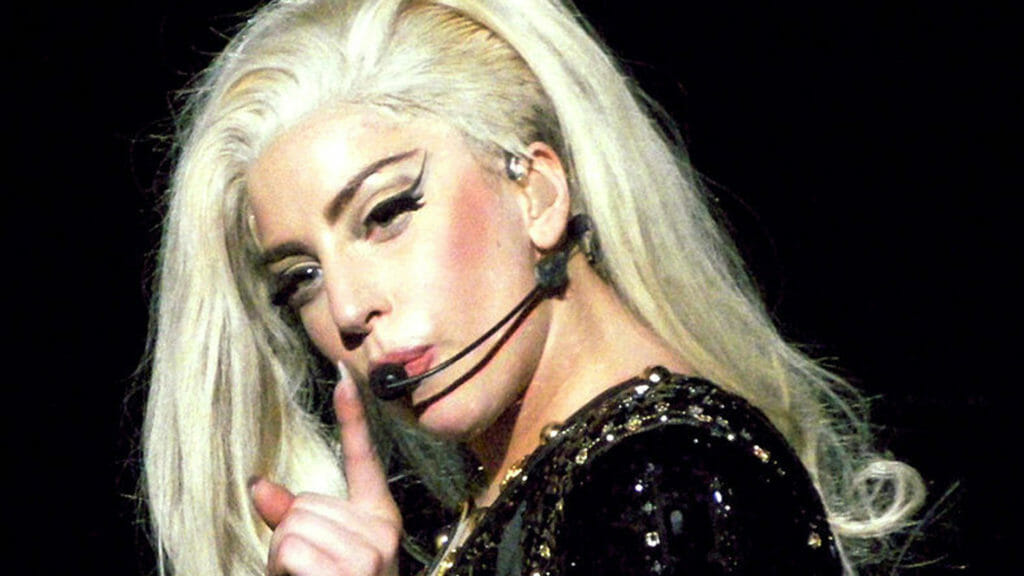 In this image: headshot of Lady Gaga performing.