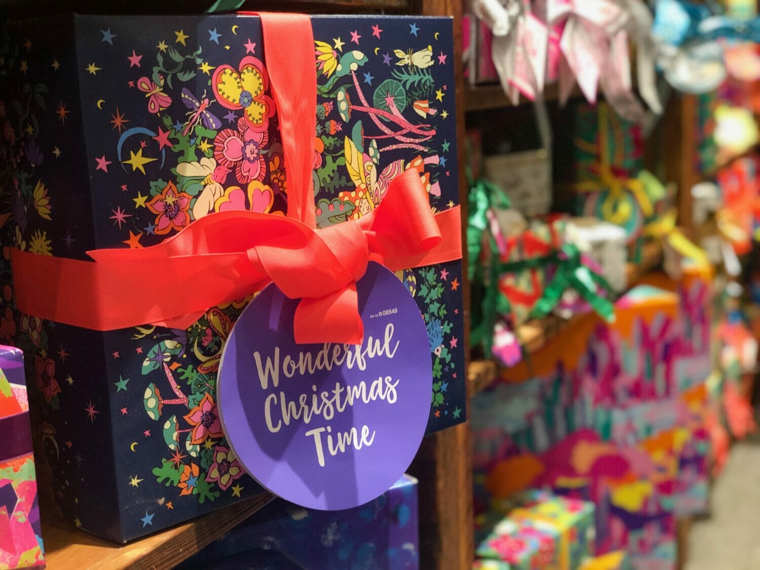 In this image: a wrapped present from LUSH.