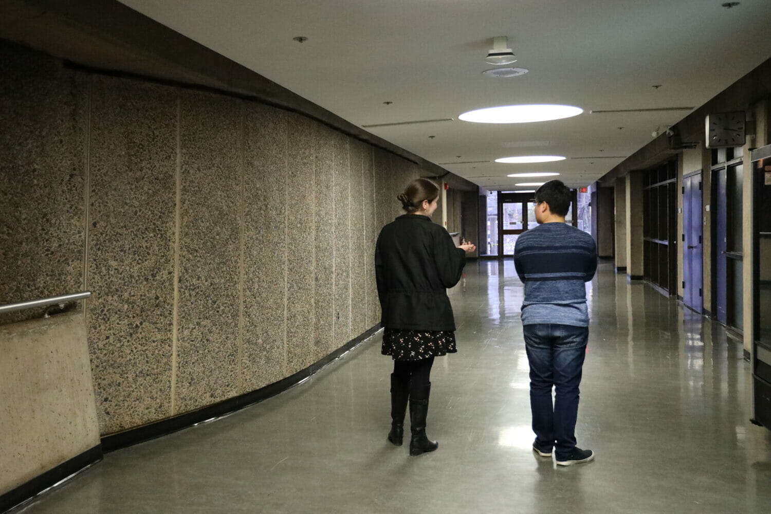 In this image: a student talks to a student advisor.