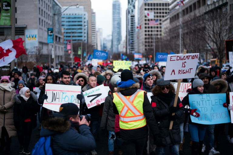 In this image: a protest against the Ford Government in Ontario.