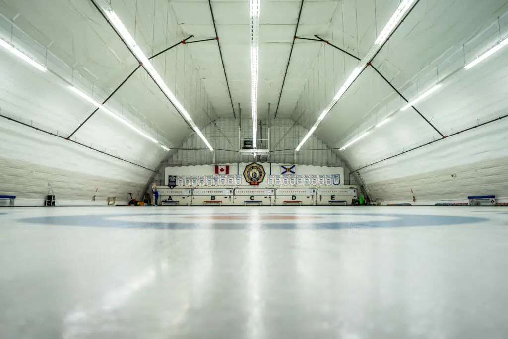 In this image: an ice rink for curling.