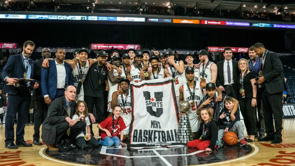 In this image: Carleton Ravens pose for a championship photo at the Scotiabank Centre.