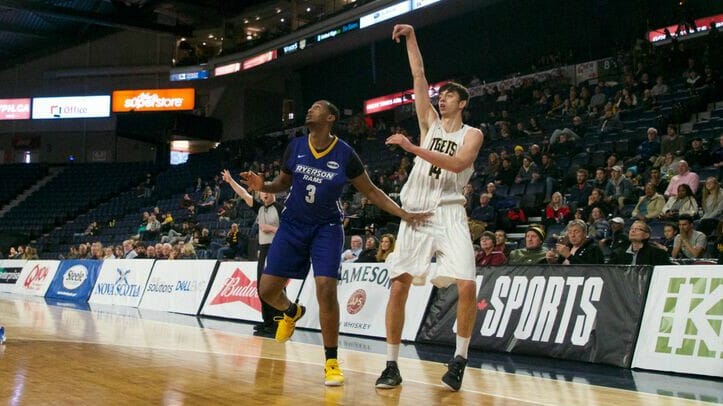 Tiger Sascha Kappos shoots a shot while Ram Warsame Mohamed watches. 