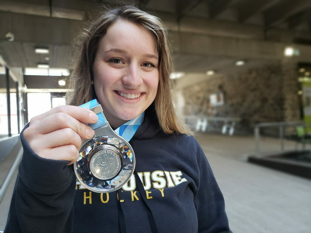 In this image: Natalie Stanwood holds a silver medal.