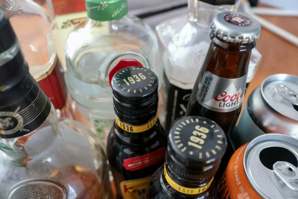 In this image: Different bottles of alcohol in a group.