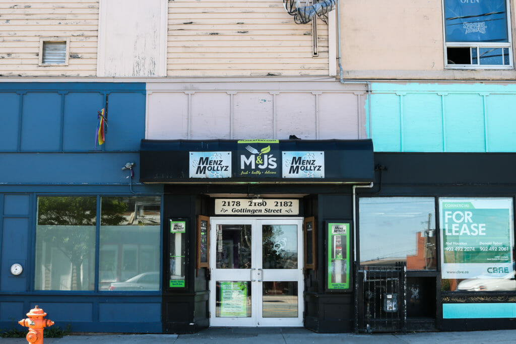 In this image: The front of Menz & Mollyz Bar.