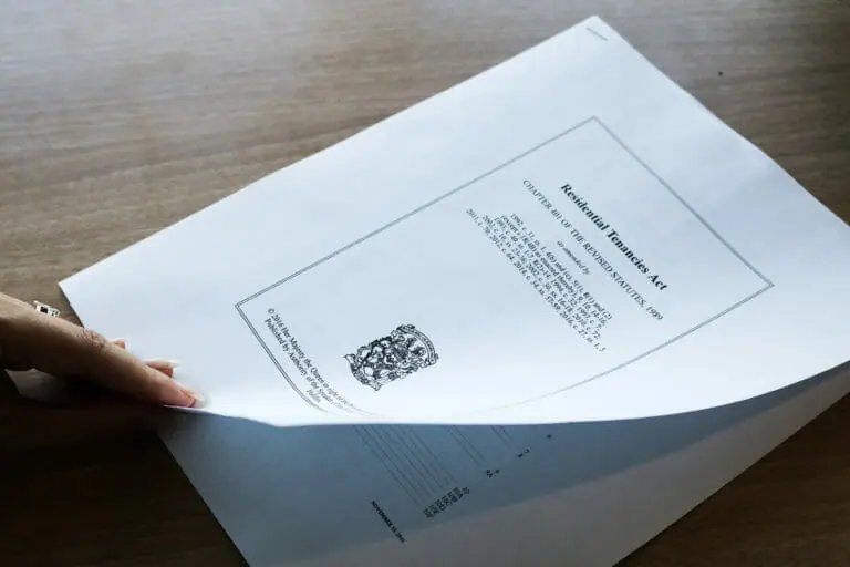 In this image: Someone about to turn the page on the Nova Scotia Residential Tenancies Act