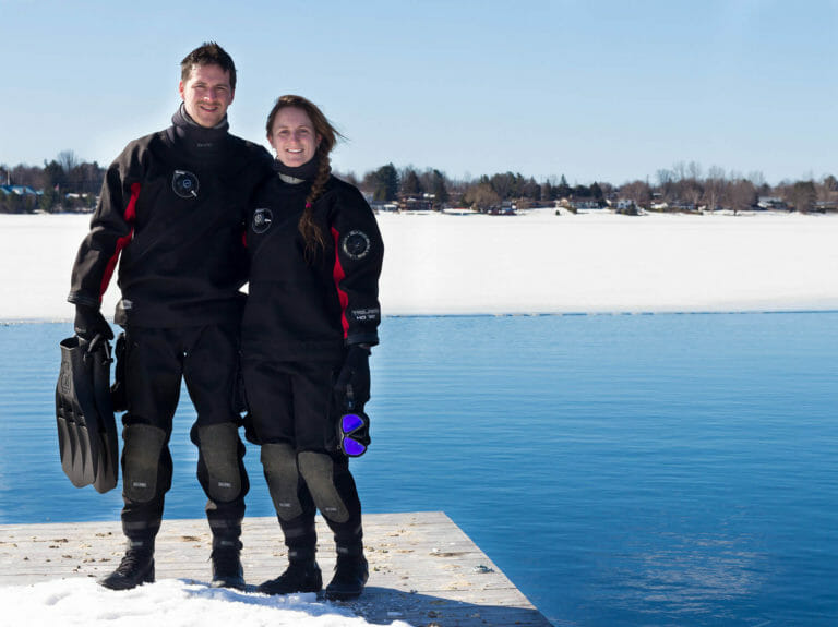 In this image: Joey and Ali Posta pose before a dive.