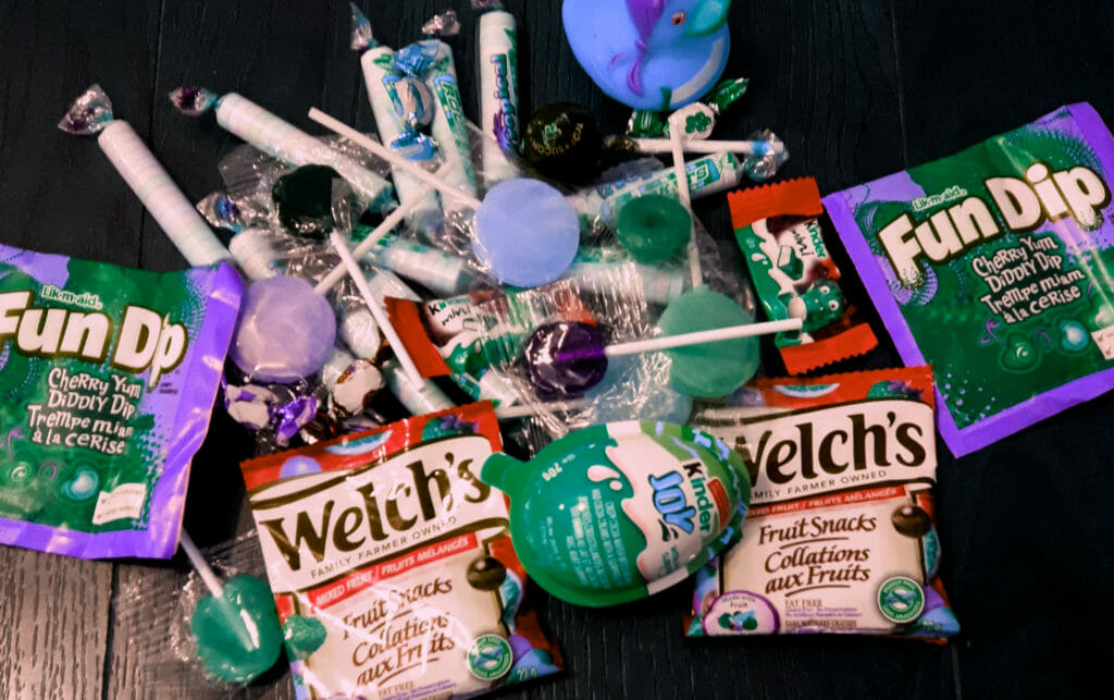 In this image: A pile of Halloween candy.