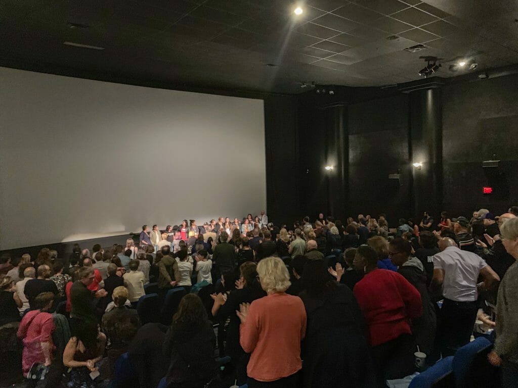 In this image: A standing ovation after the film.