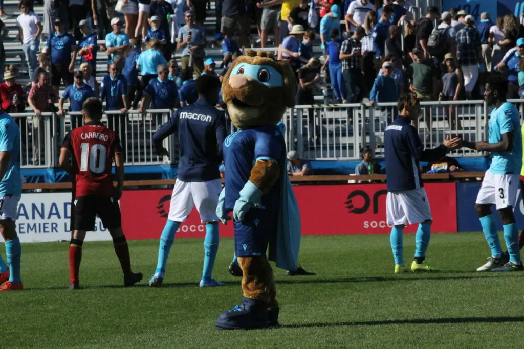 In this image: A Halifax Wanderer's mascot on the field.