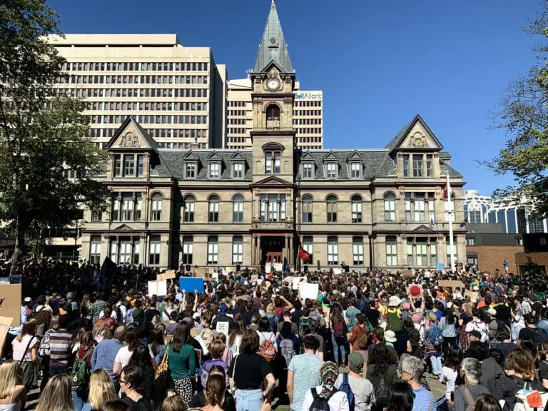 In this image: Protestors during the climate strike fill up Grand Parade in Halifax.