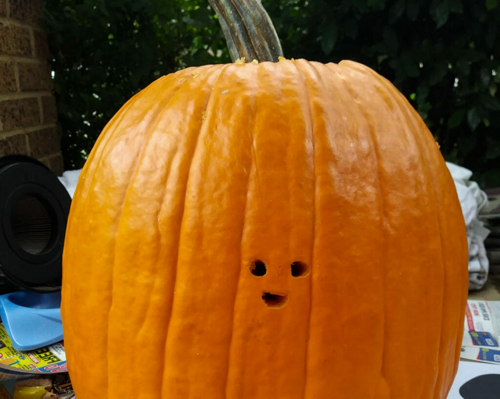 In this image: A carved pumpkin.