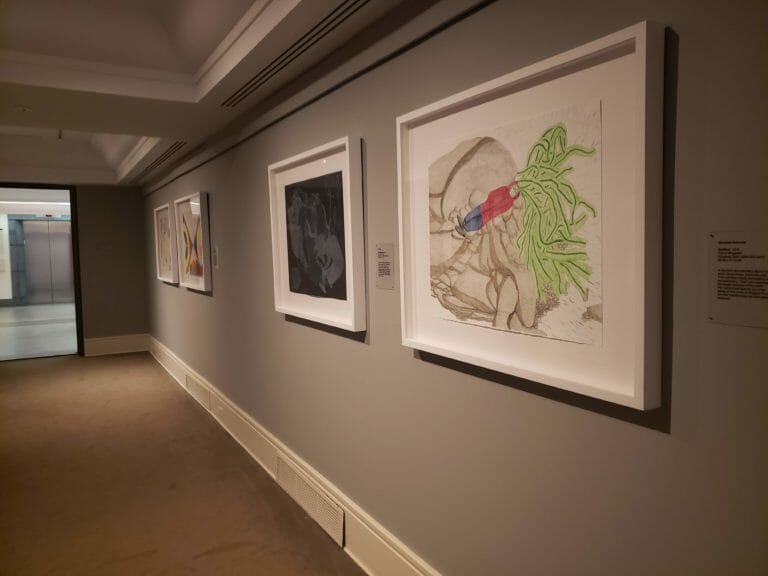 In this image: Pieces of art on a wall.