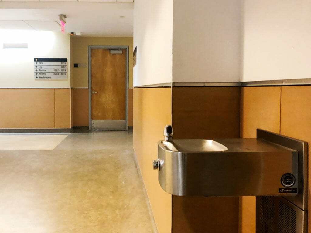In this image: A water fountain inside the Marion McCain building.