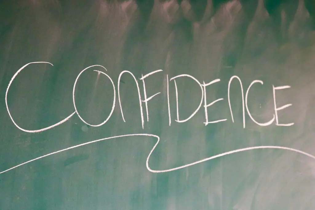 In this image: "Confidence" written on a chalkboard.