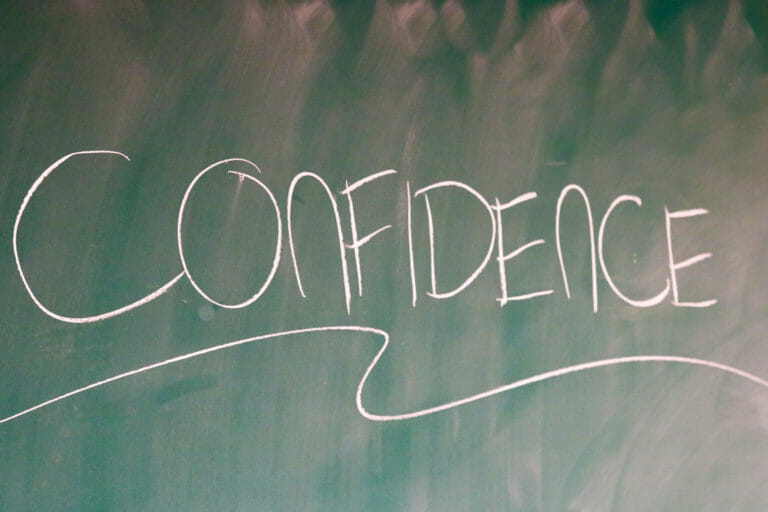 In this image: "Confidence" written on a chalkboard.