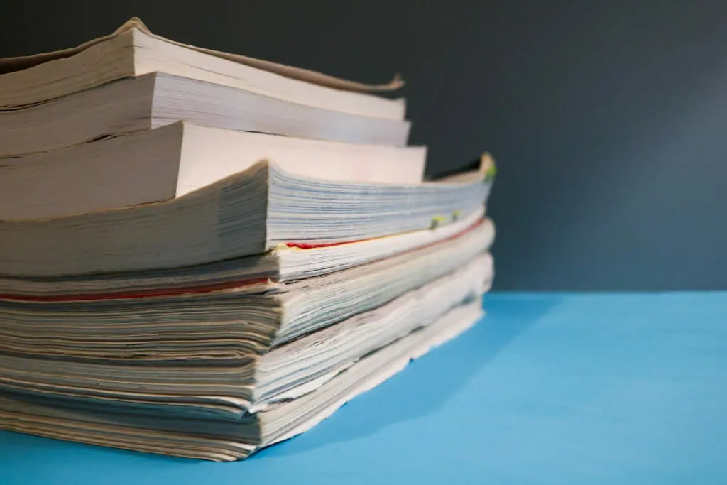 In this image: A stack of textbooks.
