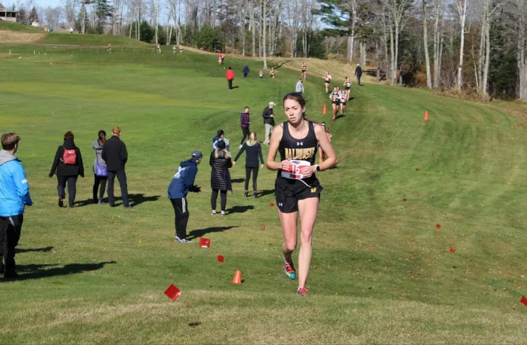 In this image: Jessica Needham running during an AUS championship meet.