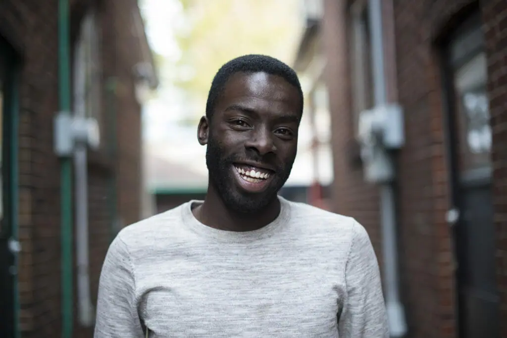 In this image: A headshot of Desmond Cole.