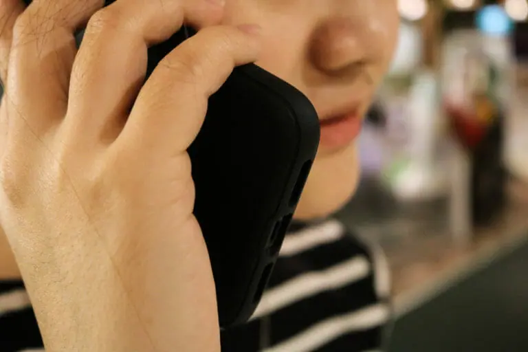 In this image: A photo illustration of a woman talking on a cellphone.