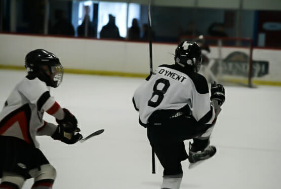 In this image: Luke Dyment pictured playing hockey.